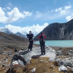 Trekkers enjyoing view of Gokyo Lake Everest region - Gokyo Lake with Everest Base Camp